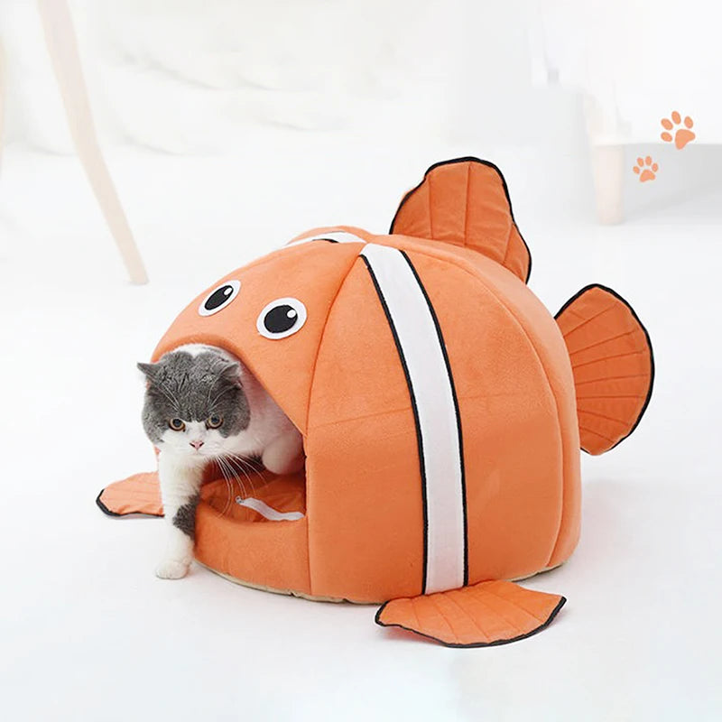 Fish-shaped pet bed with removable cushion.