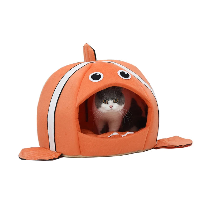 Fish-shaped pet bed with removable cushion.
